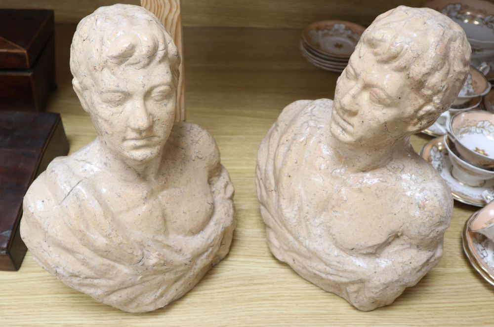 Two pink glass ceramic busts, tallest 33cm